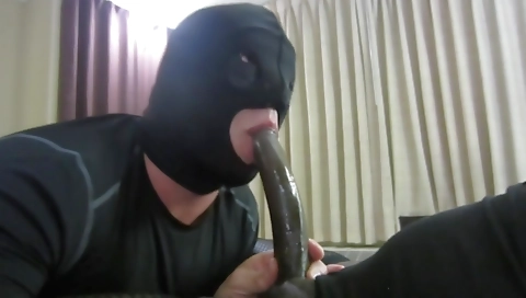 Ebony shemale with a huge black cock is giving a blow job