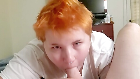 Redhead girl with a tattoo on her ass is giving a deepthroat sex