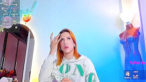 Oiled, tattoo and lingerie blonde wearing a toy