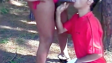 Shemale gets her mouth filled with a hard shaft outdoors